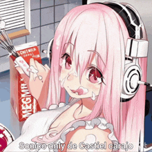 a pink haired anime girl with headphones is holding a box of chiwax