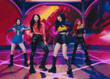 a group of girls are dancing on a stage and one of them has red hair