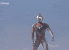a cartoon character is being struck by a lightning bolt and the word ultraman is on the bottom of the screen .