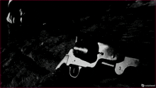 a black and white photo of a gun with the words outplayed on the bottom right