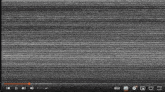 a video is being played on a screen with a gray striped background