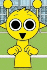 a yellow cartoon character with big eyes and antennas is standing in front of a building .