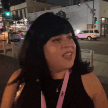 a woman with a lanyard around her neck that says ' i love you ' on it