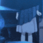 a girl in a black dress is waving her hand in a dark room