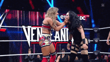 two women wrestling in front of a sign that says ' nen lani '