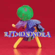 a ritmo sonora logo with a yellow doll