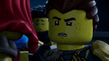 a close up of a lego character with a sad face