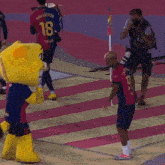 a mascot with the number 18 on his jersey