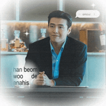 a man in a suit is sitting at a table with a speech bubble that says amour