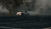 a white dodge charger driving down a street