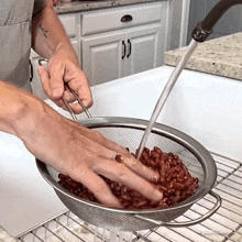 Rinsing The Beans The Whole Food Plant Based Cooking Show GIF - Rinsing The Beans The Whole Food Plant Based Cooking Show Washing The Beans GIFs