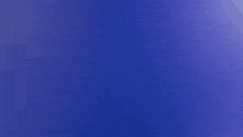 a close up of a toothbrush against a purple background