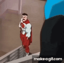 a cartoon of a man in a red cape standing next to a man in a suit .