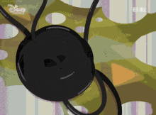 a disney channel advertisement shows a black object in a hole
