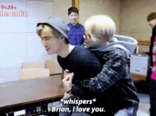 a man whispers " brian i love you " to another man in a room