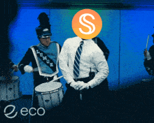 a man with a s on his head is playing drums in a band