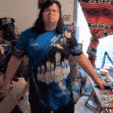 a man wearing a blue shirt that says avon