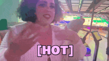 a woman in a white top says hot in a purple background