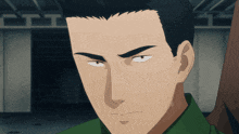 a close up of a man 's face in a green shirt