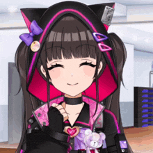 a girl in a cat ear hooded jacket is smiling