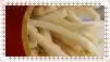 a close up of a plate of french fries with a red background .