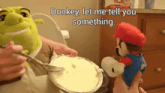 shrek and mario are playing in a bathroom and shrek is holding a fork and mario is holding a roll of toilet paper