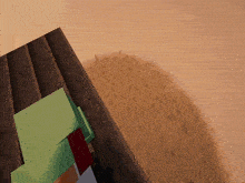 a computer generated image of a desert landscape with a green cube in the foreground