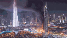 a city at night with a large building that says ' dubai ' on the top