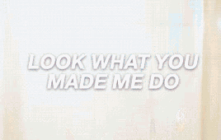 a man is sitting on a swing with the words `` look what you made me do '' written above him .