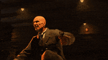 a man in a leather jacket is pointing his finger at the camera