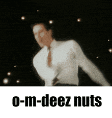 a man in a white shirt and tie is dancing and the words o-m-deez nuts are below him