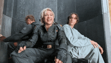 a man and a woman are sitting next to each other