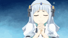 a girl with a tiara on her head is praying