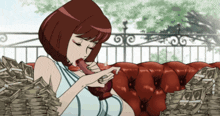 a woman is laying on a red couch with a stack of money behind her