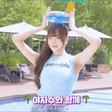 a woman wearing a blue tank top with superradiu on it
