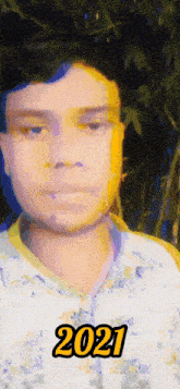 a man 's face is shown with the year 2021 in yellow letters