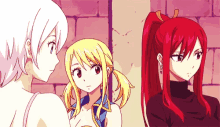 a group of three anime girls are standing next to each other and talking .