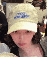 a woman wearing a baseball cap that says " i do n't know "