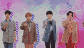 a group of young men standing next to each other with their thumbs up
