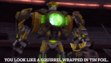 a robot with the words you look like a squirrel wrapped in tin foil below it