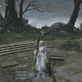 a woman in a white dress is holding a large sword