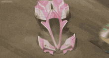 a row of yostar cans are lined up on a pink background