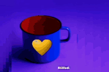 a blue mug with a yellow heart on it and the name aliabdi on the bottom