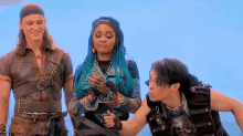 a group of people are standing next to each other in front of a blue sky .