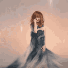 a woman in a long dress is on the cover of an album