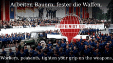 a large crowd of people are gathered in front of a sign that says " arbeiter bauern fester die waffen "