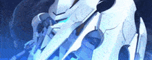 a close up of a white robot with a blue light on it .