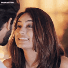a close up of a woman 's face with the words barunsobtigifs at the top