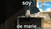 a person is standing next to a suitcase that says soy de marie on it