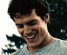 a close up of a man 's face with a smile on it